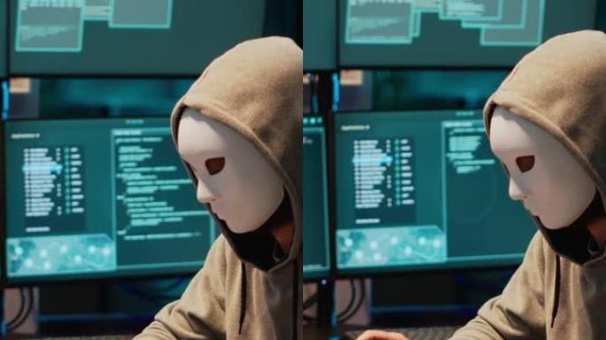 垂直视频: 带有面具黑客数据库服务器的IT小偷程序员