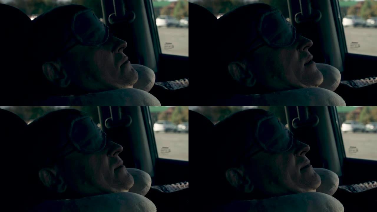 疲倦的司机戴着睡眠面罩试图入睡。