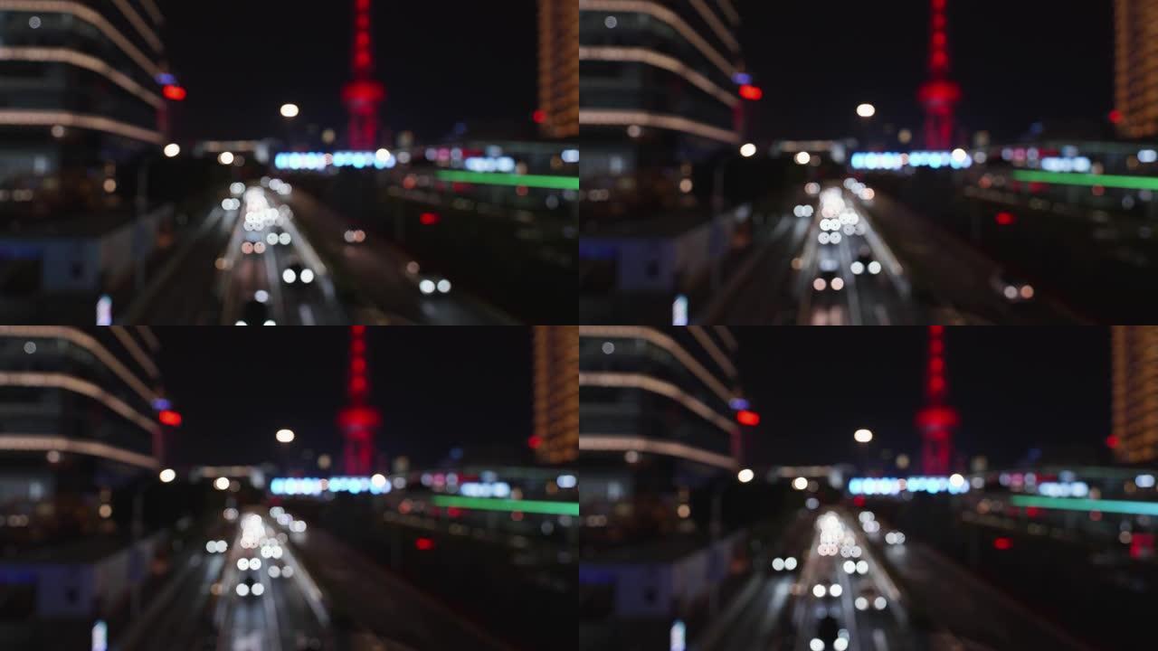 散焦道路交通运输城市之夜。模糊的灯bokeh汽车前灯行驶黄昏城市道路。模糊的夜间城市交通。背景城市街