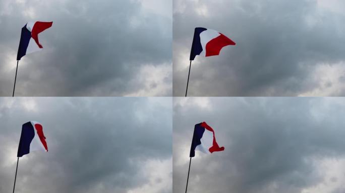 在多云的天空上编织法国国旗