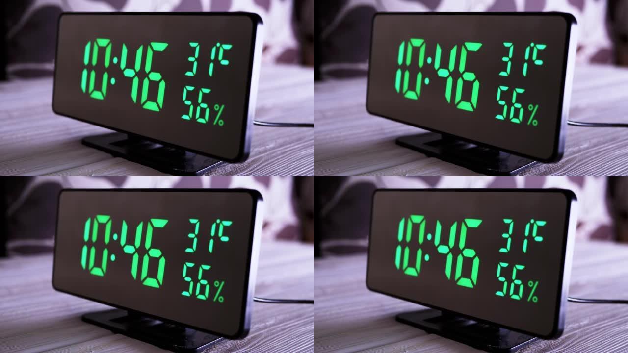 数字时钟在绿色显示上午10:45上显示时间、温度、空气湿度
