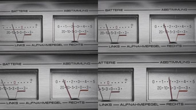 银色立体声录音机上的模拟VU仪表，箭头指示器