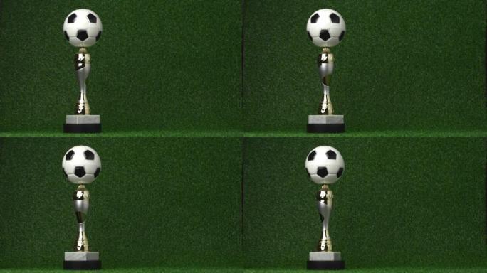 足球冠军奖杯随着金色的五彩纸屑而旋转。视频4K