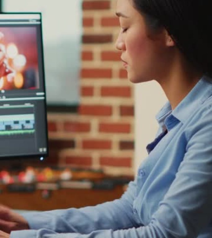 垂直视频: 亚洲电影制片人在多显示器上编辑视频和音频片段
