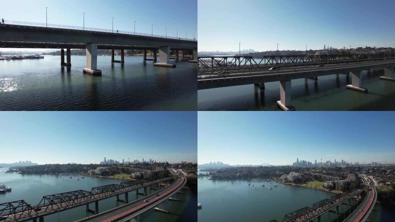 澳大利亚悉尼铁湾桥和维多利亚路的鸟瞰图，上面有汽车行驶