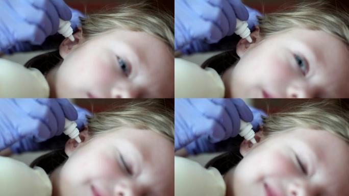 医生将消炎药滴入儿童耳朵特写4k电影慢动作