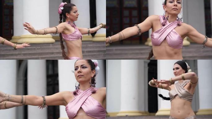 自信的才华横溢的女性跳舞印度舞蹈移动手改变位置的中等镜头。城市户外美丽的白人表演者。艺术和技能概念。