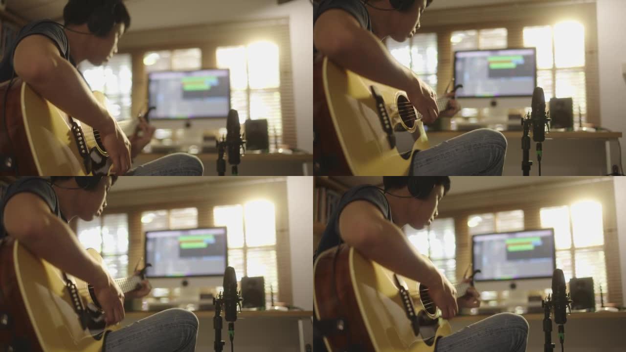 在家里，音乐家记录吉他的声音。