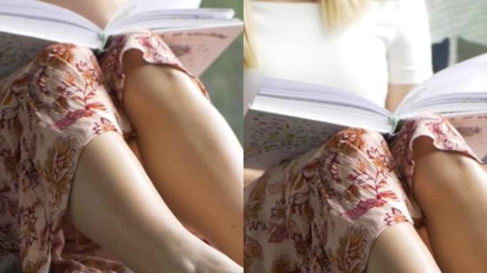 澳大利亚年轻女子躺在窗台上看书的垂直镜头