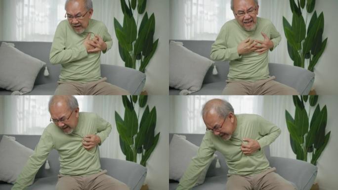 心脏病发作症状，老年人室内心脏病发作，老年人手触摸心脏，紧急情况老年人突然心脏病发作。面对不健康的医