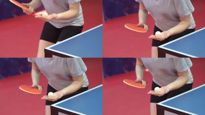 女子乒乓球或乒乓球运动员的特写镜头，慢动作