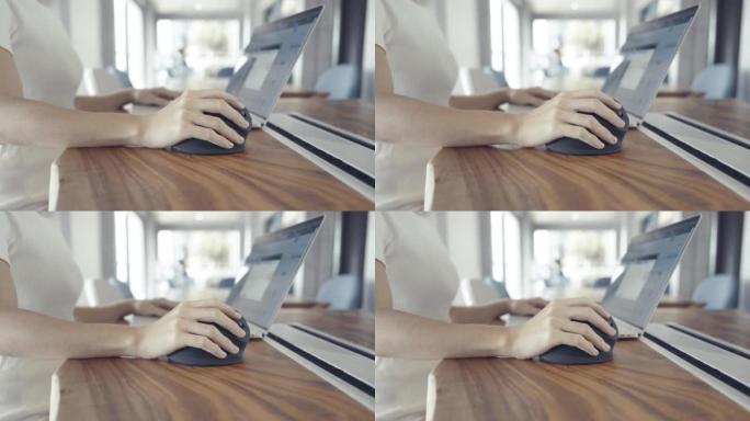 女人手使用电脑符合人体工程学的鼠标，防止手腕疼痛，因为工作时间长。De Quervain s腱鞘炎，