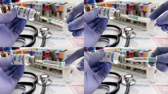 医生拿着新冠病毒疫苗的注射器和小瓶，进行第四剂抗欧米克隆变异强化疫苗接种