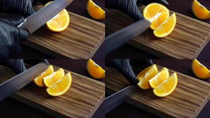 男子用菜刀在木砧板上切成生橙。家庭烹饪概念。特写