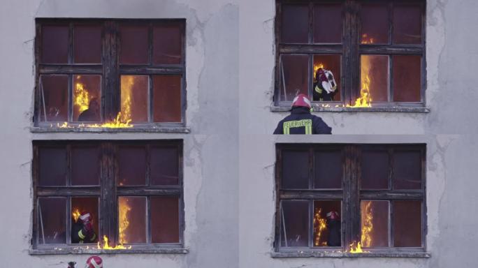 消防员英雄从火灾事故中从燃烧的建筑区域带走女婴。从危险的地方营救人们