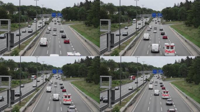 在科隆繁忙的德国高速公路上，一群车辆快速行驶，慢动作