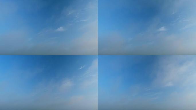 蓝色天堂夏日云景。滚动的浮肿的白色层状云正在移动。延时。