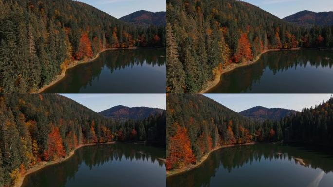 无人机沿着深邃而野生的著名高山锡内维尔湖 (Sinevir) 环绕着拍摄的空中山脉飞行。湖周围的绿色