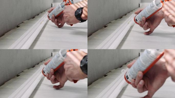 DIY，在预算有限的情况下在家里的层压地板上安装踢脚板。