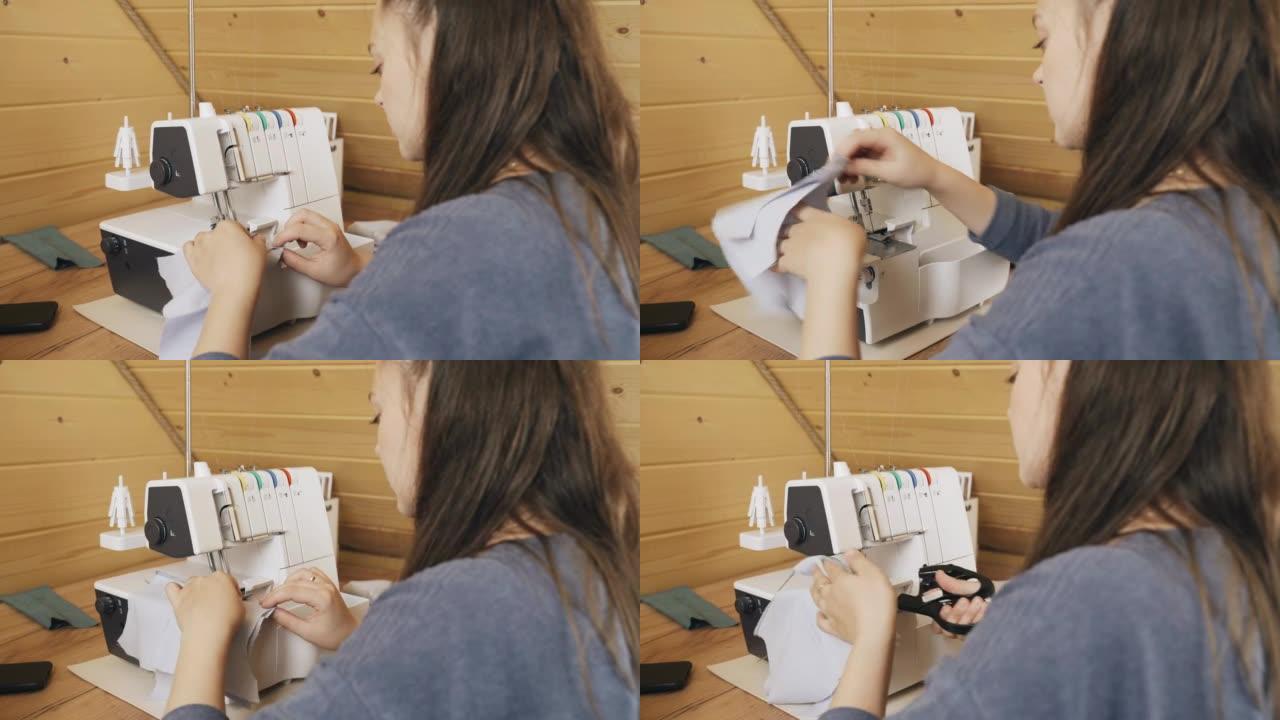 一位女设计师在包缝机上进行裁缝。