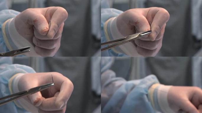 外科医生用一只手在沾满鲜血的医疗手套中穿针引线。医生正准备缝合手术切口。行动结束的概念。