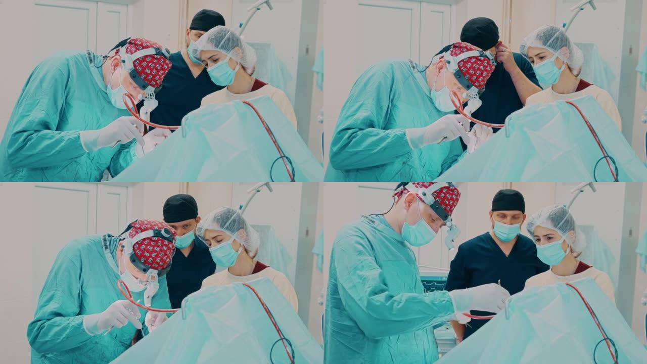 护士在口腔手术过程中帮助外科医生