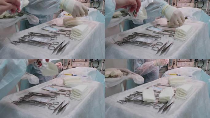 宠物手术的开始。外科医生从桌子上拿了一把手术刀。助手打开无菌湿巾的包装，并用仪器将其放在桌子上。