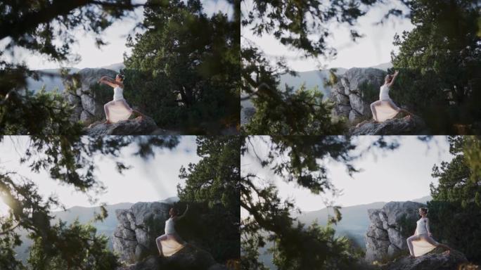 身穿白色长裙的年轻女子站在悬崖上做瑜伽