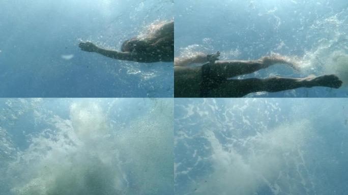 从水下慢动作看到的男子游泳爬行动作