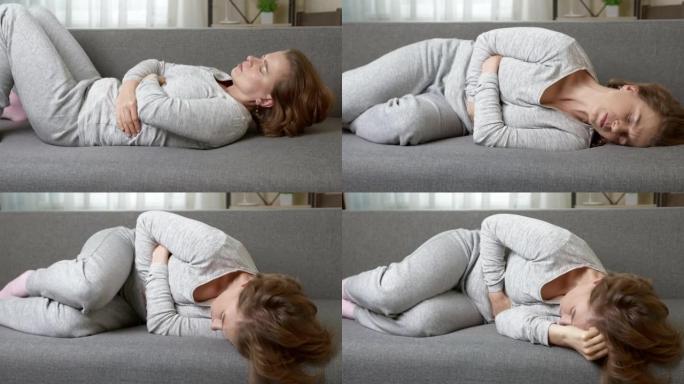 躺在沙发上的腹部疼痛。月经周期，经期。腹泻概念。