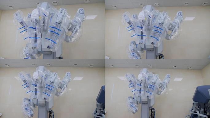 达芬奇机器人站在手术室的墙上。塑料覆盖的高精度先进技术设备。