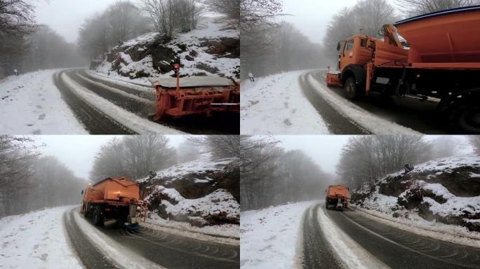 冬季大降雪后，扫雪车清洁了穿越山脉的道路
