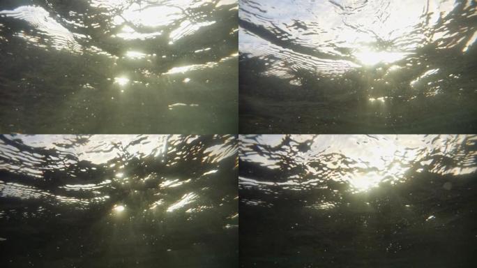 溺水。水下阳光。不同形式和形状的气泡在水中。版本3