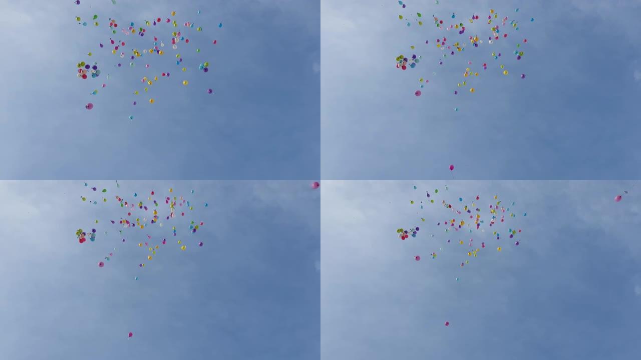 彩色气球在午后的天空中飞走