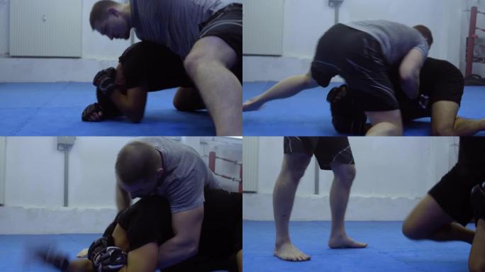 MMA战士在健身房训练格斗，手持跟踪射击