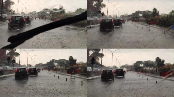 意大利罗马，10月-10。2022。在雨中行驶时，通过车窗行驶的道路视图。在雨中从汽车挡风玻璃上的交
