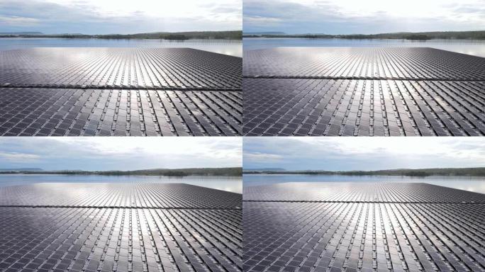 带有太阳能电池的浮动太阳能电池发电厂在湖上发电，航拍视频