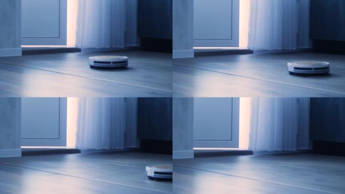 真空机器人真空吸尘器在公寓清洁的地板上移动。在日常生活中帮助人们的技术。用智能机器人吸尘器打扫房子