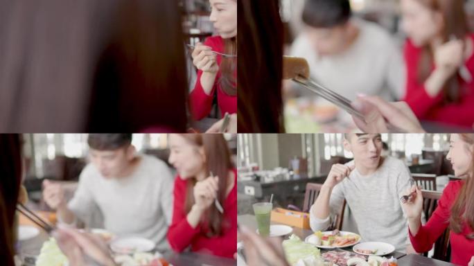 快乐的年轻人在火锅餐厅用餐