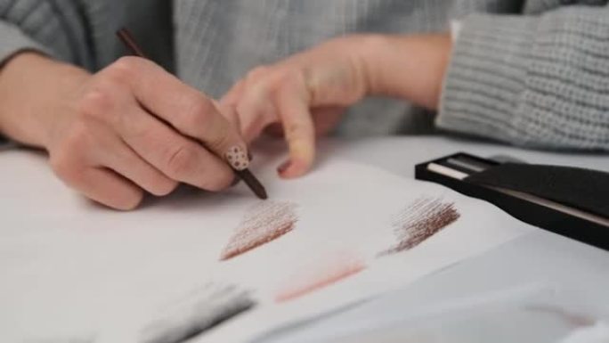 Woman drawing with pencil