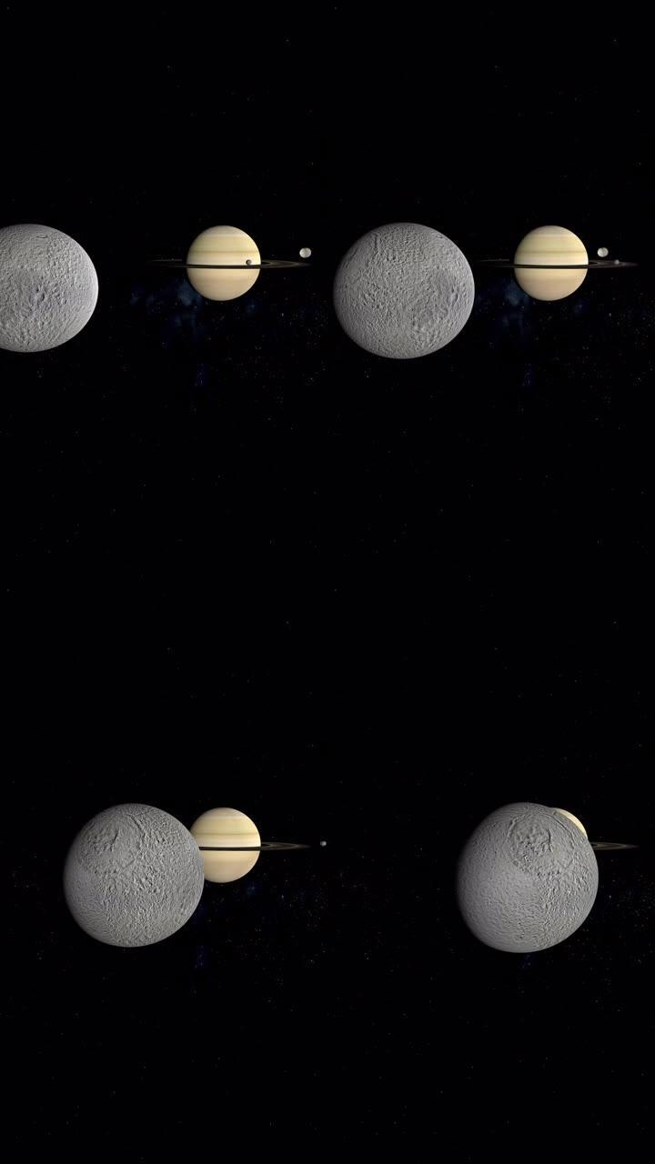 特提斯、米玛斯和土卫二围绕土星行星运行。4k垂直