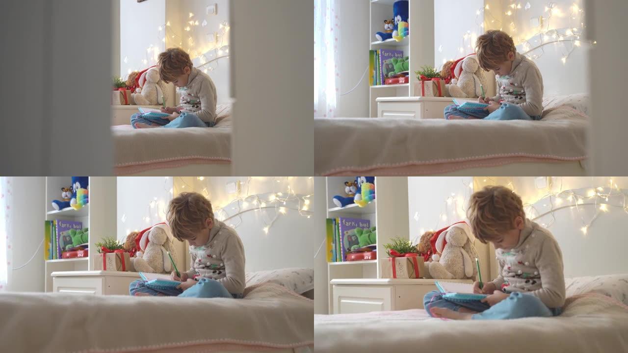 圣诞奇迹愿望清单。穿着舒适毛衣的微笑女孩写信给圣诞老人礼物。孩子躺在家里的床上，带着圣诞灯。