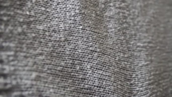 针织灰色亚克力围巾纺织品抽象背景。