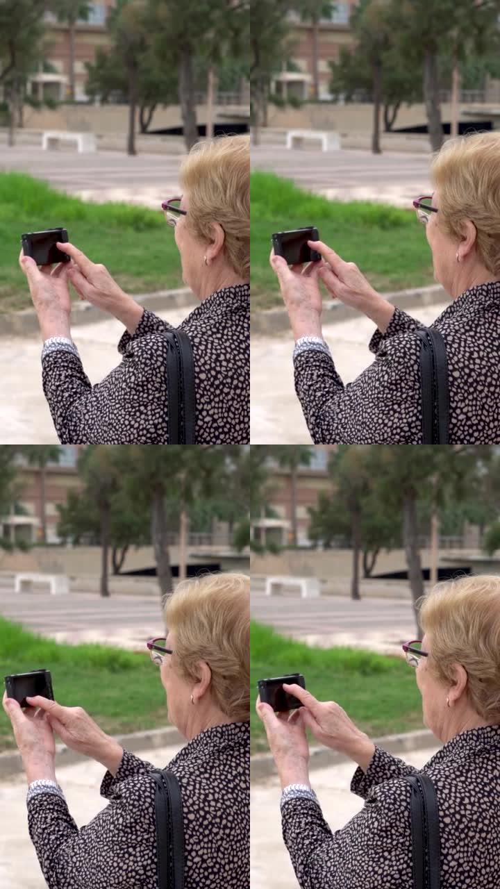慢动作，年长的女人在外面使用相机