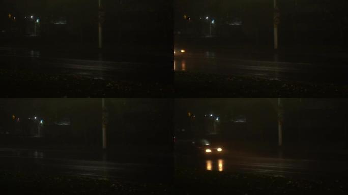 汽车在雾，雨的夜晚沿着城市街道行驶。