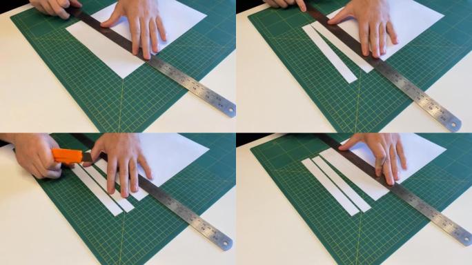用美工刀在切割垫上切割纸，模型制作