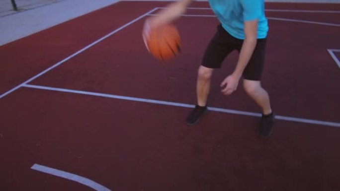 年轻人打篮球特写，将球扔进环，篮球技巧，动态射门
