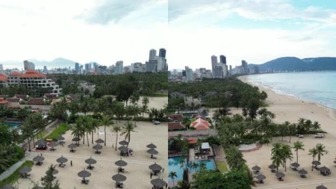 越南临海沙滩上的酒店和游泳池鸟瞰图