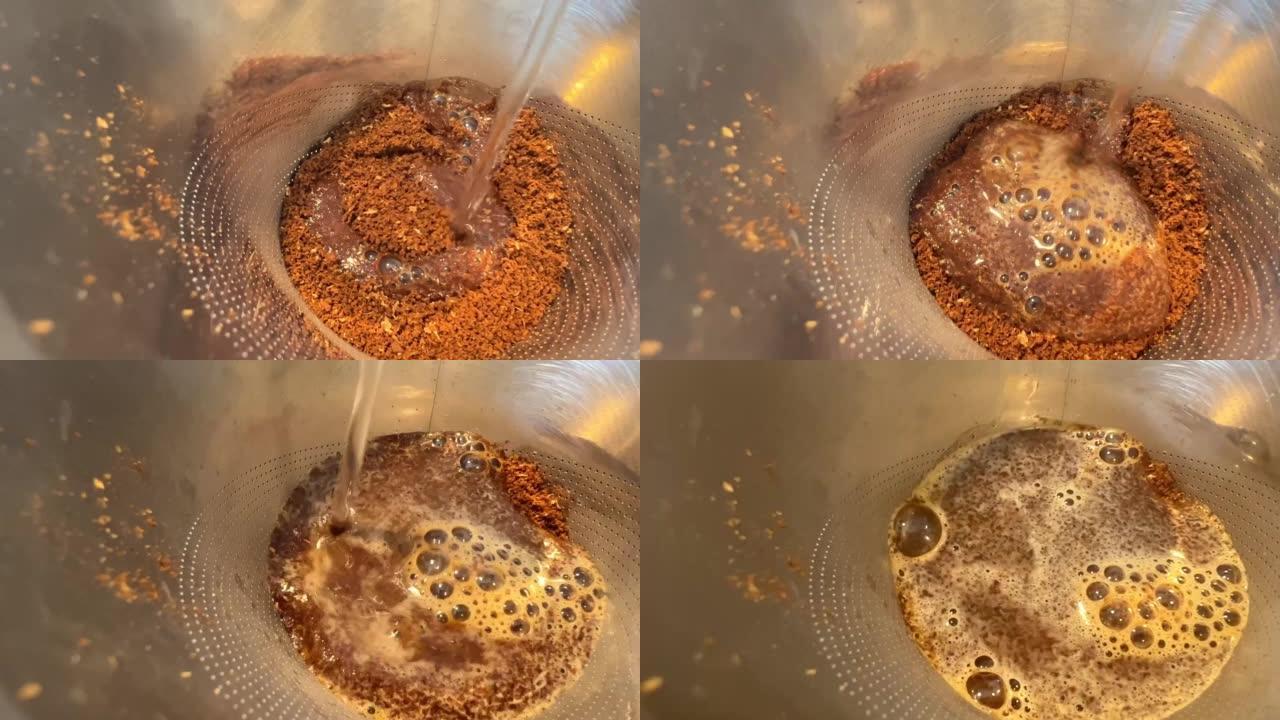 有文字空间开水热水倒入一个有磨碎谷物的水壶咖啡豆的特写视图蒸汽上升到咖啡室上的咖啡气泡出现