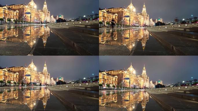雨天上海外滩景观的4k延时镜头，人行道上水坑中历史建筑地标的完美反映，倾斜效果。